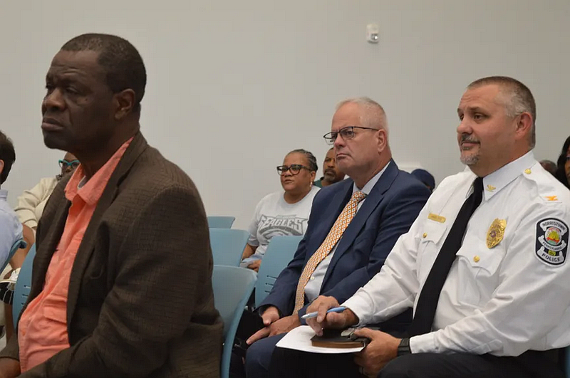 Lansdale Police Chief Michael Trail, center, sits in the audience of an Aug. 19 Norristown Municipal Council work session. Also pictured, from left, is Norristown Public Works Director Thomas Odenigbo and Interim Police Chief James Angelucci. (Rachel Ravina – MediaNews Group)