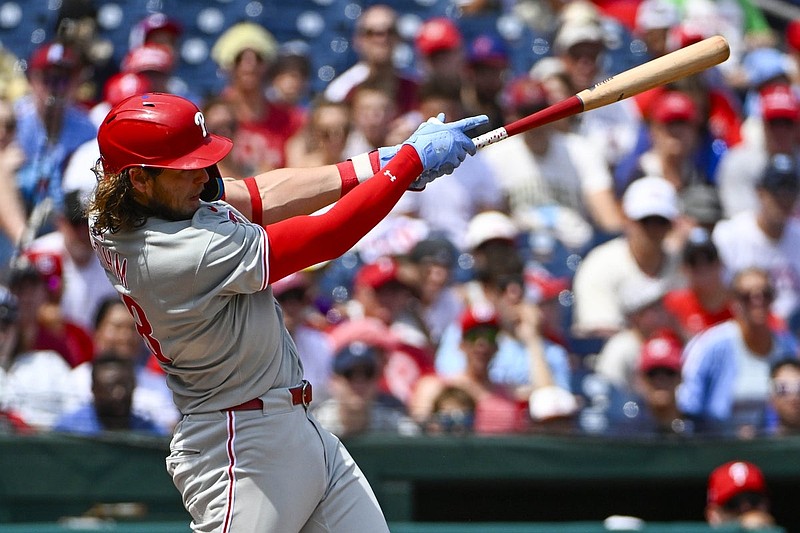 Aug 17, 2025; Washington, District of Columbia, USA; Philadelphia Phillies third baseman Alec Bohm (28) hits a three run home run against the Washington Nationals during the second inning at Nationals Park. Mandatory Credit: Brad Mills-Imagn Images