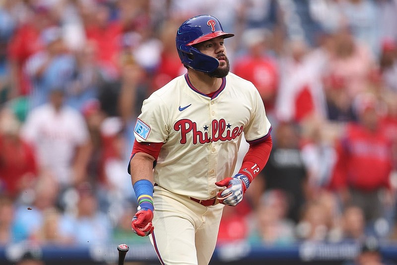Aug 20, 2025; Philadelphia, Pennsylvania, USA; Philadelphia Phillies outfielder Kyle Schwarber (12) hits a two RBI home run during the eighth inning against the Seattle Mariners at Citizens Bank Park. Mandatory Credit: Bill Streicher-Imagn Images