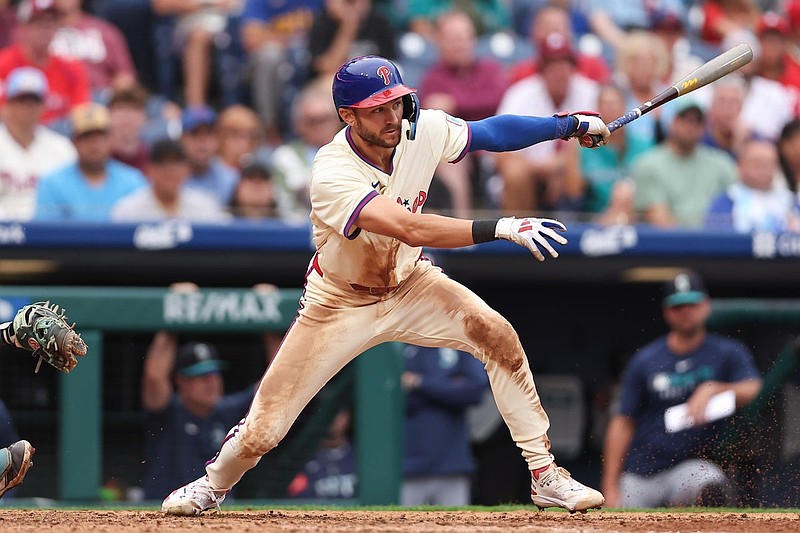 Aug 20, 2025; Philadelphia, Pennsylvania, USA; Philadelphia Phillies shortstop Trea Turner (7) hits an RBI single during the seventh inning against the Seattle Mariners at Citizens Bank Park. Mandatory Credit: Bill Streicher-Imagn Images