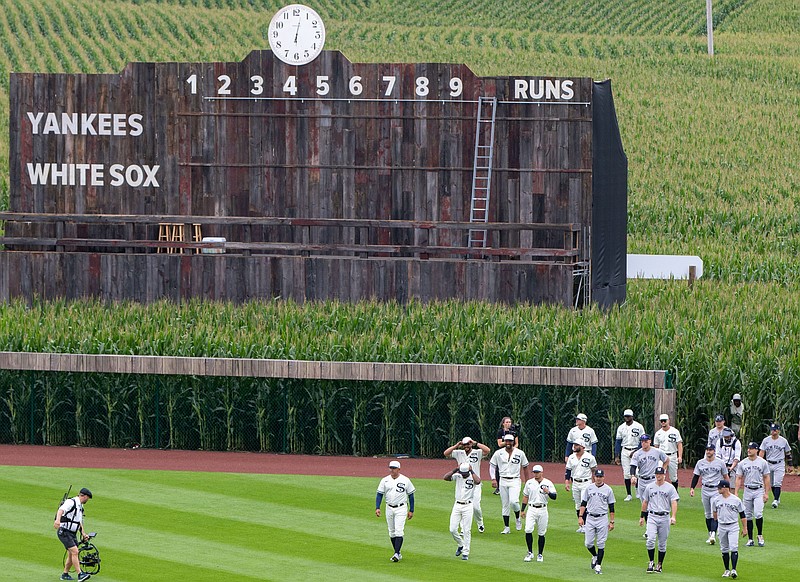 Aug 12, 2021; Dyersville, IA, USA; Players enter the field thought the corn before a game between the New York Yankees and the Chicago White Sox near the Field of Dreams movie site outside of Dyersville, Thursday, Aug. 12, 2021. Mandatory Credit: Zach Boyden-Holmes-USA TODAY NETWORK