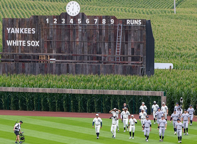 Aug 12, 2021; Dyersville, IA, USA; Players enter the field thought the corn before a game between the New York Yankees and the Chicago White Sox near the Field of Dreams movie site outside of Dyersville, Thursday, Aug. 12, 2021. Mandatory Credit: Zach Boyden-Holmes-USA TODAY NETWORK
