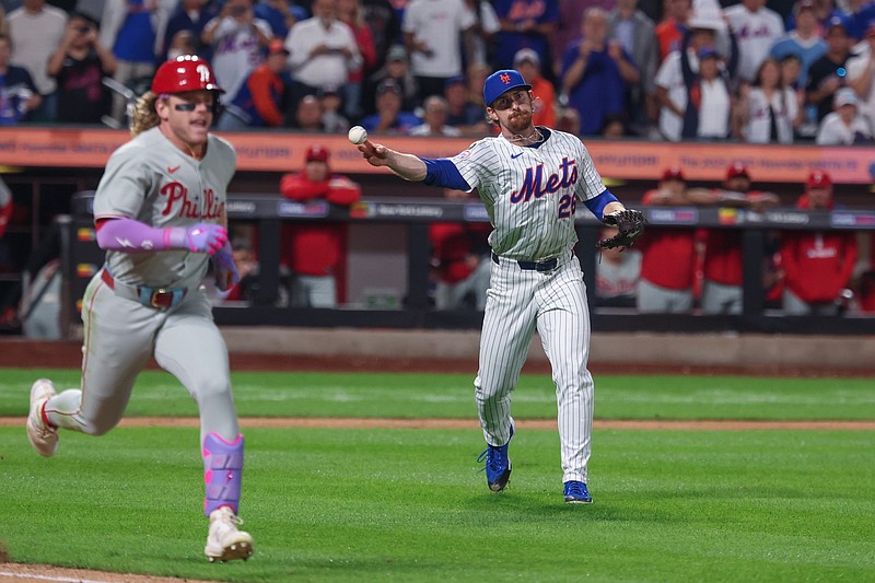 Aug 27, 2025; New York City, New York, USA; New York Mets starting pitcher Nolan McLean (26) throws the ball to first base for an out on a ground ball hit by Philadelphia Phillies left fielder Harrison Bader (2) during the eighth inning at Citi Field. Mandatory Credit: Vincent Carchietta-Imagn Images