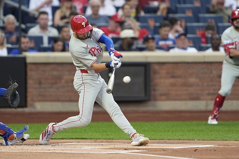 Aug 25, 2025; New York City, New York, USA; Philadelphia Phillies shortstop Trea Turner (7) hits a triple against the New York Mets during the first inning at Citi Field. Mandatory Credit: Gregory Fisher-Imagn Images