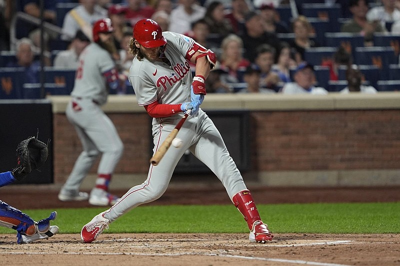Aug 25, 2025; New York City, New York, USA; Philadelphia Phillies third baseman Alec Bohm (28) hits an RBI single against the New York Mets during the third inning at Citi Field. Mandatory Credit: Gregory Fisher-Imagn Images
