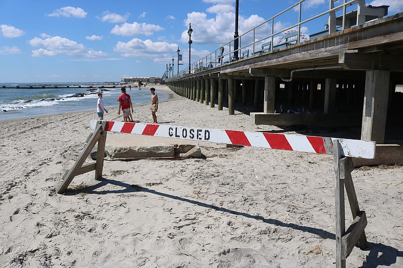A "Closed" sign serves as a barricade to the badly eroded beach at 5th Street in Ocean City.