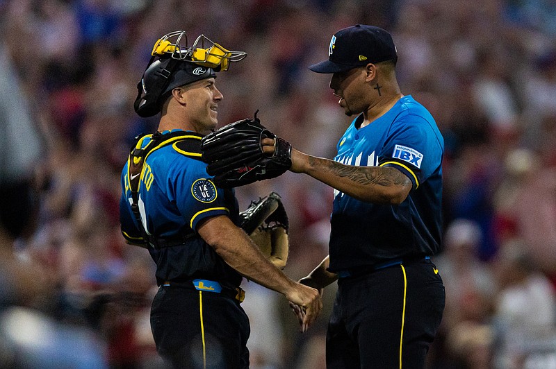 Aug 1, 2025; Philadelphia, Pennsylvania, USA; Philadelphia Phillies pitcher Jhoan Duran (59) celebrates with catcher J.T. Realmuto (10) after a victory against the Detroit Tigers at Citizens Bank Park. Mandatory Credit: Bill Streicher-Imagn Images
