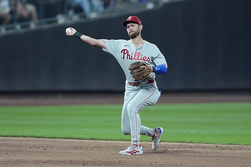 Aug 25, 2025; New York City, New York, USA;  Philadelphia Phillies shortstop Trea Turner (7) throws out New York Mets third baseman Mark Vientos (27) (not pictured) after fielding a ground ball during the second inning at Citi Field. Mandatory Credit: Gregory Fisher-Imagn Images
