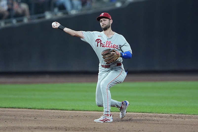 Aug 25, 2025; New York City, New York, USA;  Philadelphia Phillies shortstop Trea Turner (7) throws out New York Mets third baseman Mark Vientos (27) (not pictured) after fielding a ground ball during the second inning at Citi Field. Mandatory Credit: Gregory Fisher-Imagn Images