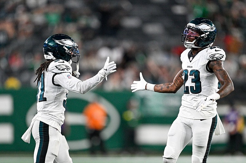 Aug 22, 2025; East Rutherford, New Jersey, USA; Philadelphia Eagles cornerback Eli Ricks (23) celebrates after the play with Philadelphia Eagles safety Andre' Sam (31) during the fourth quarter against the New York Jets at MetLife Stadium. Mandatory Credit: Mark Smith-Imagn Images