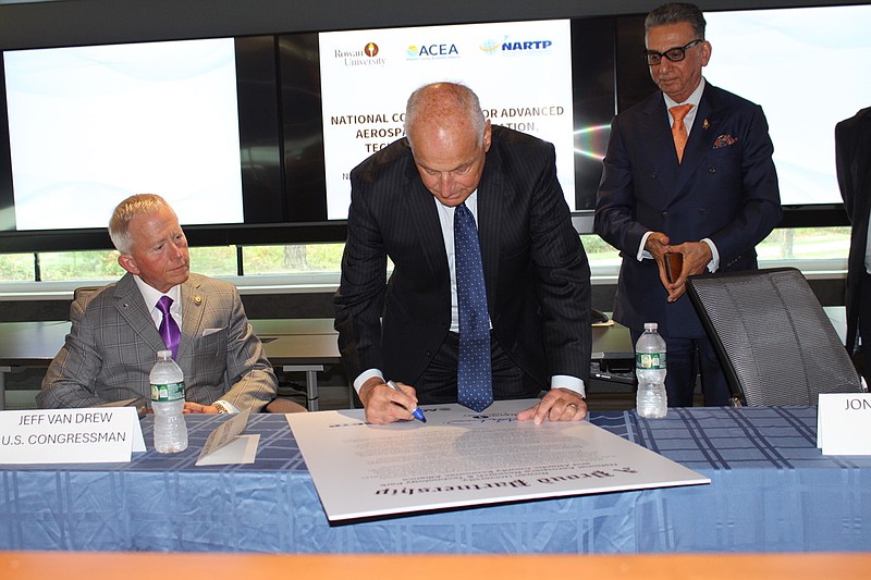 PROVIDED/Howard Kyle signs the Memorandum of Understanding creating a constorium dedicated to advancing aviation technology, safety and workforce development.