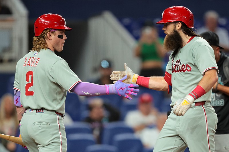 Sep 5, 2025; Miami, Florida, USA; Philadelphia Phillies center fielder Brandon Marsh (16) celebrates with center fielder Harrison Bader (2) after hitting a two-run home ruin against the Miami Marlins during the fourth inning at loanDepot Park. Mandatory Credit: Sam Navarro-Imagn Images