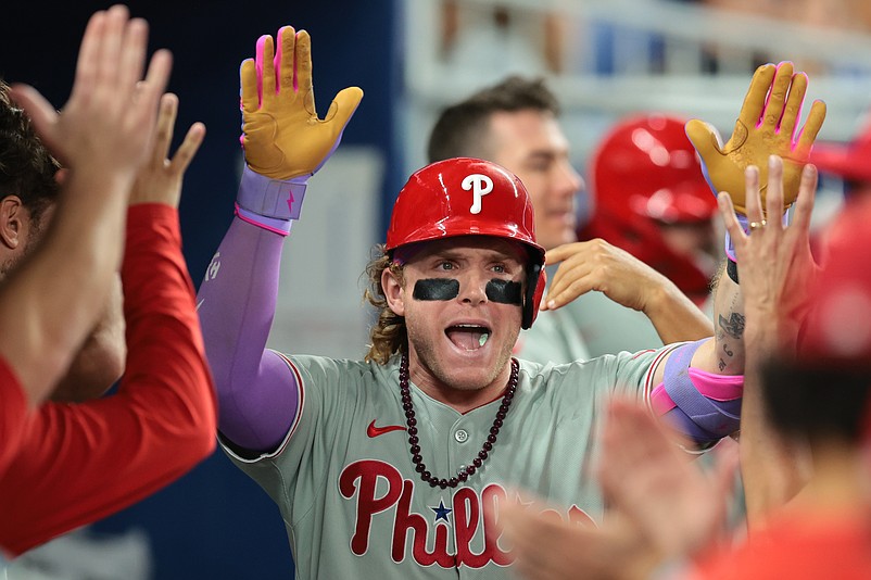 Sep 5, 2025; Miami, Florida, USA; Philadelphia Phillies center fielder Harrison Bader (2) celebrates with teammates after hitting a home run against the Miami Marlins during the fourth inning at loanDepot Park. Mandatory Credit: Sam Navarro-Imagn Images