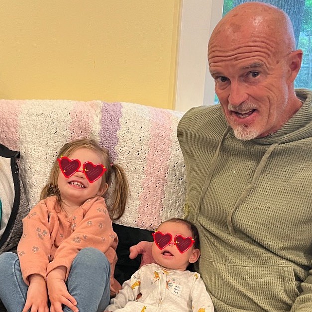 Steve Bouchard with his granddaughters. (GiveInKind photo)