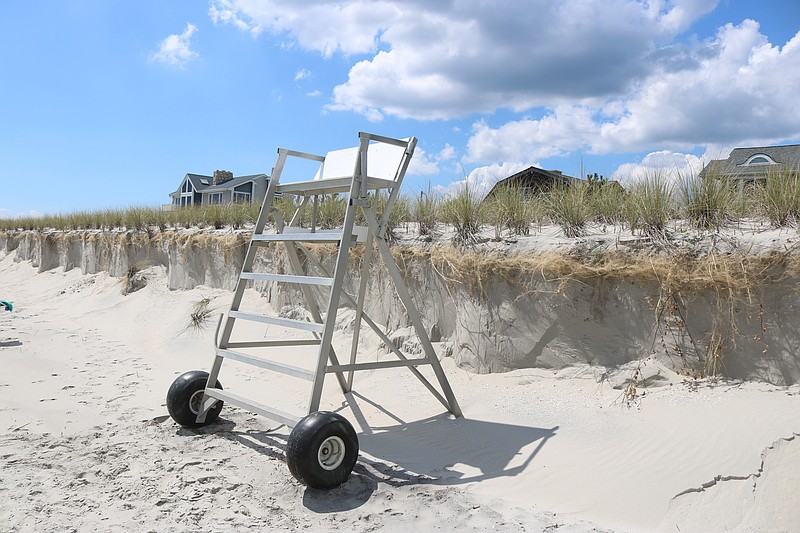 Dune erosion caused by Hurricane Erin is evident behind a lifeguard stand at Vincent Avenue in Strathmere.