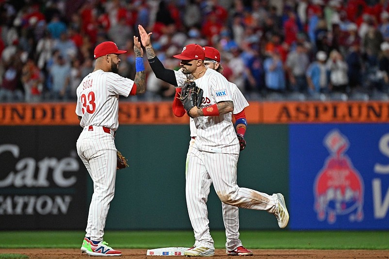 Sep 8, 2025; Philadelphia, Pennsylvania, USA;  Philadelphia Phillies second base Edmundo Sosa (33) and  outfielder Nick Castellanos (8) celebrate win against the New York Mets at Citizens Bank Park. Mandatory Credit: Eric Hartline-Imagn Images
