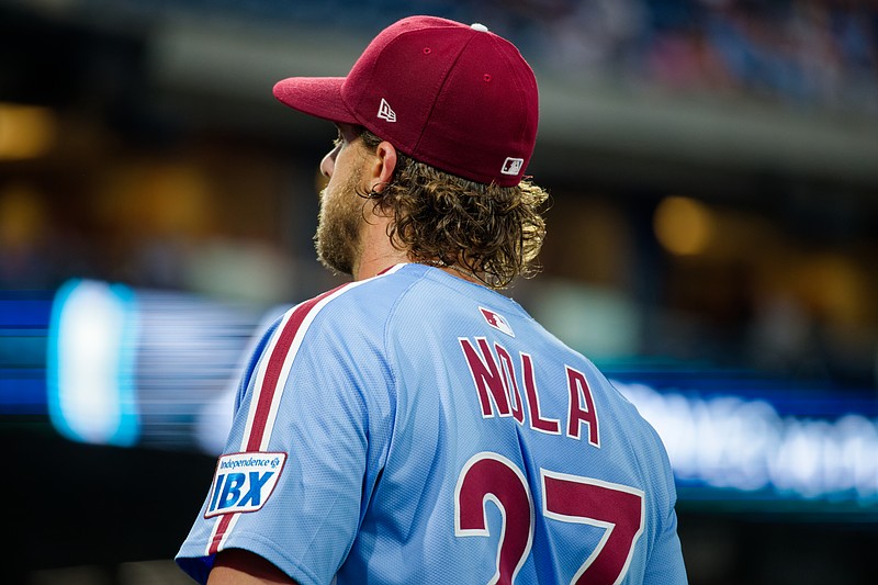 Aug 28, 2025; Philadelphia, Pennsylvania, USA; Philadelphia Phillies pitcher Aaron Nola walks into the dugout before a game against the Atlanta Braves at Citizens Bank Park. (Grace Del Pizzo/On Pattison)