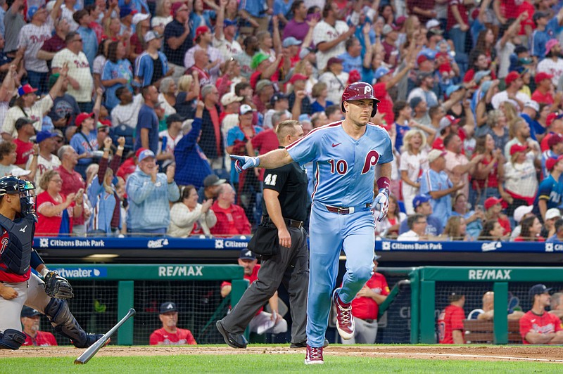 Aug 28, 2025; Philadelphia, Pennsylvania, USA; Philadelphia Phillies catcher J.T. Realmuto drops his bat after hitting a two-run home run against the Atlanta Braves at Citizens Bank Park. (Grace Del Pizzo/On Pattison)