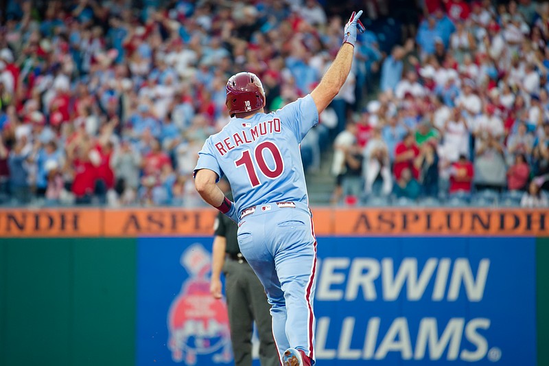 Aug 28, 2025; Philadelphia, Pennsylvania, USA; Philadelphia Phillies catcher J.T. Realmuto salutes the bullpen after hitting a two-run home run against the Atlanta Braves at Citizens Bank Park. (Grace Del Pizzo/On Pattison)