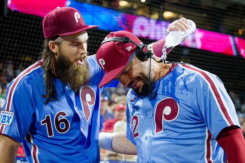 Aug 28, 2025; Philadelphia, Pennsylvania, USA; Philadelphia Phillies outfielder Brandon Marsh pours water on designated hitter Kyle Schwarber to celebrate his historic four home runs against the Atlanta Braves at Citizens Bank Park. (Grace Del Pizzo/On Pattison)