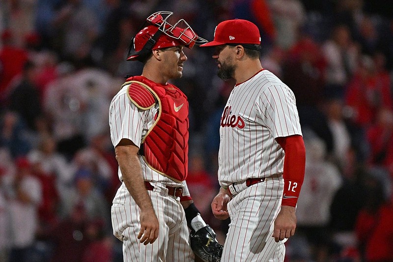 Sep 9, 2025; Philadelphia, Pennsylvania, USA; Philadelphia Phillies catcher J.T. Realmuto (10) and  outfielder Kyle Schwarber (12) celebrate win against the New York Mets at Citizens Bank Park. Mandatory Credit: Eric Hartline-Imagn Images