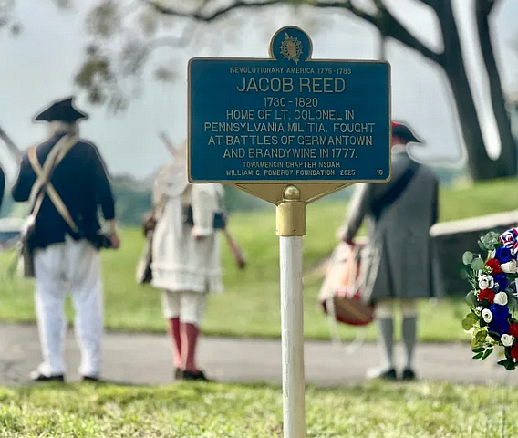 A marker telling the story of Hatfield Revolutionary-era Lt. Col. Jacob Reed was dedicated on Saturday, Sept. 6, 2025, and is seen with Towamencin SAR members in the background. (Photos courtesy of Towamencin DAR)