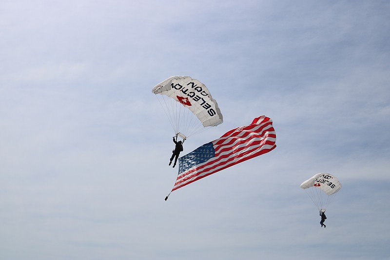 Two Fastrax skydivers prepare to make a landing on the beach to start the show.