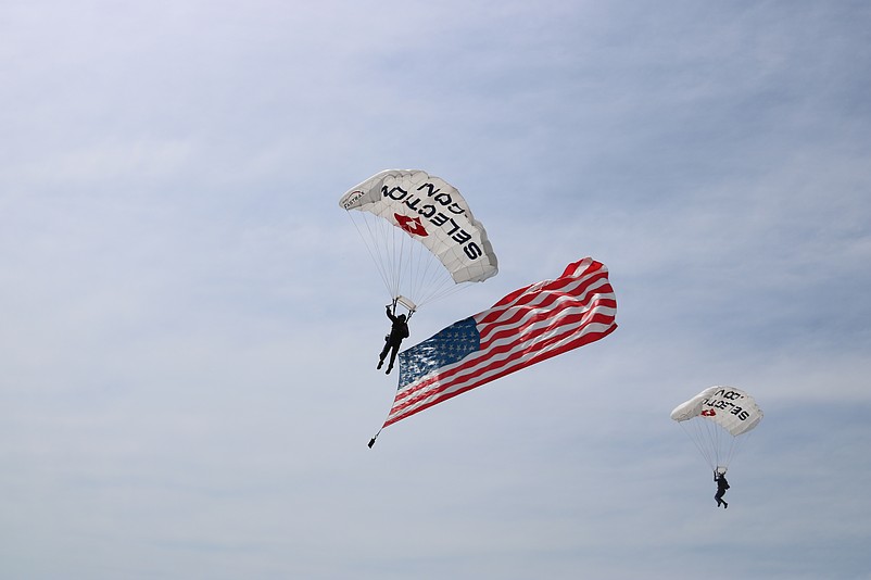 Two Fastrax skydivers prepare to make a landing on the beach to start the show.