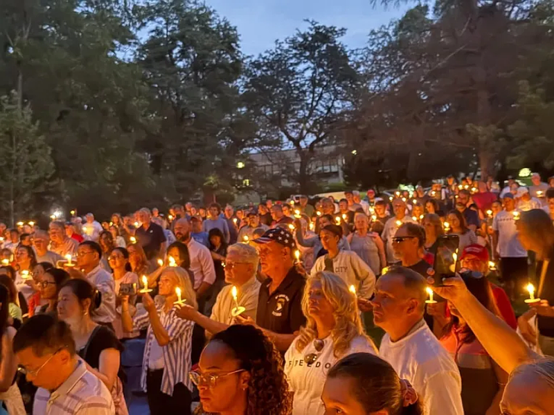 Community members hold candles at a ‘Charlie Kirk Candlelight Vigil for Peace’ in memory of the slain activist in Weingartner Park in North Wales on Sunday night. (Photo courtesy of Lisa Vogel)