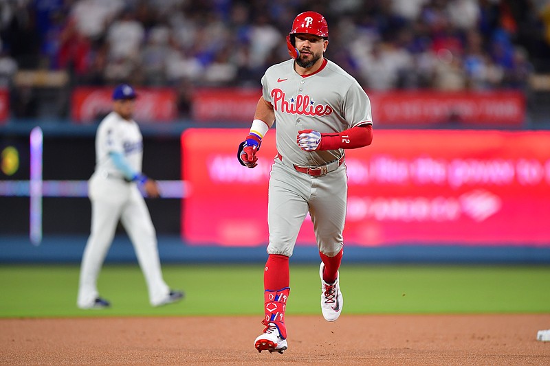 Sep 15, 2025; Los Angeles, California, USA; Philadelphia Phillies outfielder Kyle Schwarber (12) rounds the bases after hitting a solo home run against the Los Angeles Dodgers in the first inning at Dodger Stadium. Mandatory Credit: Gary A. Vasquez-Imagn Images