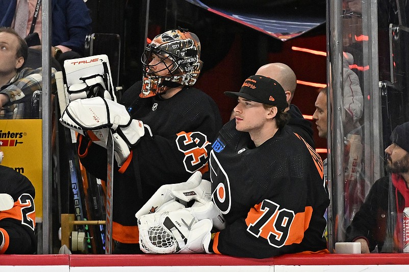 Jan 21, 2024; Philadelphia, Pennsylvania, USA;  Philadelphia Flyers goaltender Samuel Ersson (33) and goaltender Carter Hart (79) watch from the bench against the Ottawa Senators during the third period at Wells Fargo Center. Mandatory Credit: Eric Hartline-USA TODAY Sports