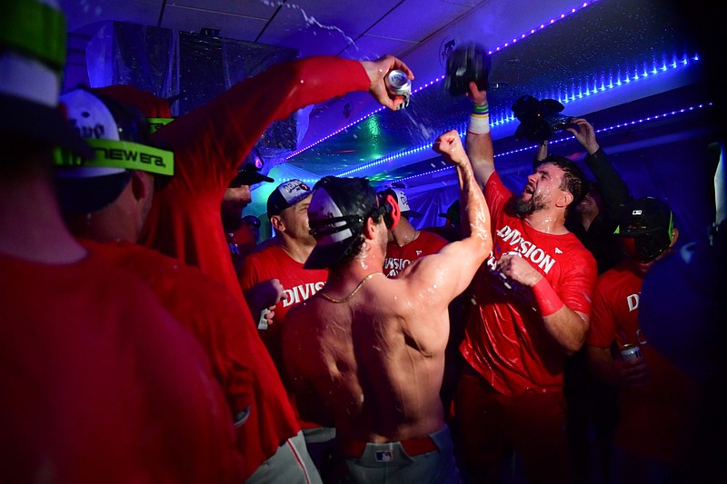 Sep 15, 2025; Los Angeles, California, USA; designated hitter Kyle Schwarber (12) and the Philadelphia Phillies celebrate after clinching the Nationall League East division title at Dodger Stadium. Mandatory Credit: Gary A. Vasquez-Imagn Images
