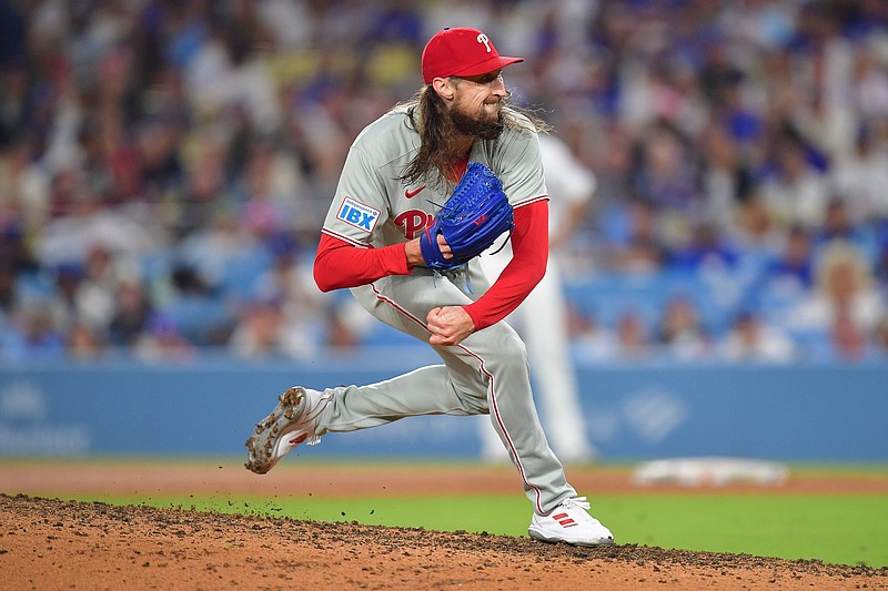 Sep 15, 2025; Los Angeles, California, USA;Philadelphia Phillies pitcher Matt Strahm (25) throws against the Los Angeles Dodgers during the eighth inning at Dodger Stadium. Mandatory Credit: Gary A. Vasquez-Imagn Images