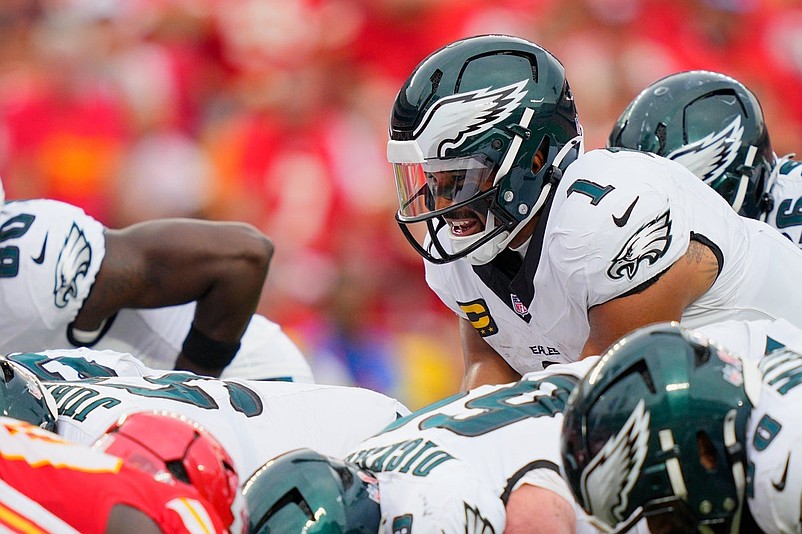 Sep 14, 2025; Kansas City, Missouri, USA; Philadelphia Eagles quarterback Jalen Hurts (1) calls a play at the line of scrimmage against the Kansas City Chiefs during the fourth quarter of the game at GEHA Field at Arrowhead Stadium. Mandatory Credit: Jay Biggerstaff-Imagn Images