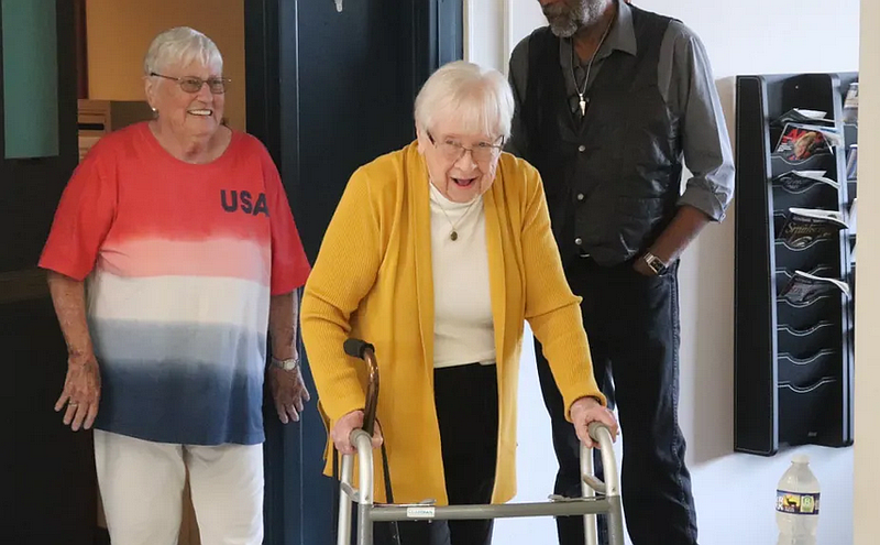 Joan Kane walks into her surprise 100th birthday party at Grundy Manor in Telford.