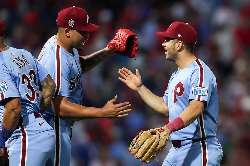 Sep 11, 2025; Philadelphia, Pennsylvania, USA; Philadelphia Phillies pitcher Jhoan Duran (59) and Otto Kemp (R) shake hands after a win against the New York Mets at Citizens Bank Park. Mandatory Credit: Bill Streicher-Imagn Images