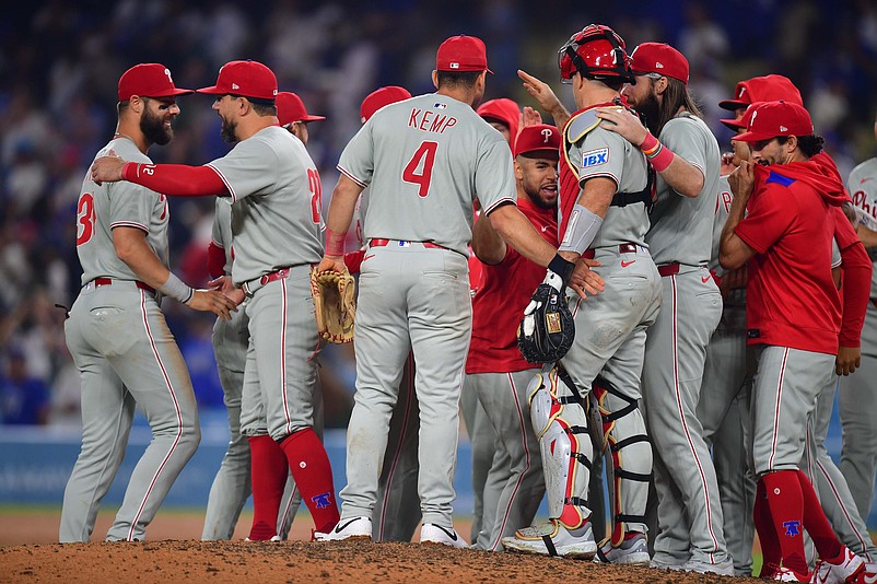 Sep 15, 2025; Los Angeles, California, USA; Philadelphia Phillies celebrate the victory against the Los Angeles Dodgers and clinching the National League East division title at Dodger Stadium. Mandatory Credit: Gary A. Vasquez-Imagn Images