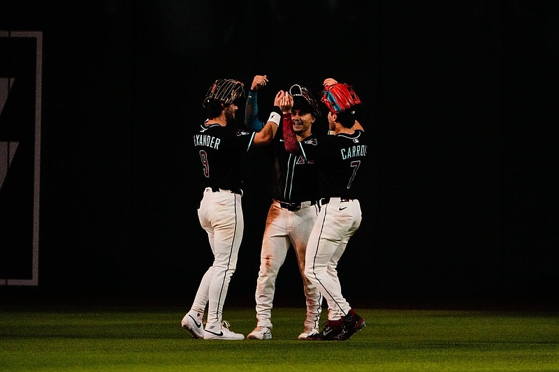Sep 6, 2025; Phoenix, Arizona, USA; The outfielders ( Blaze Alexander (9), Alek Thomas (5) and Corbin Carroll (7) celebrate the win over the Boston Red Sox at Chase Field. Mandatory Credit: Arianna Grainey-Imagn Images