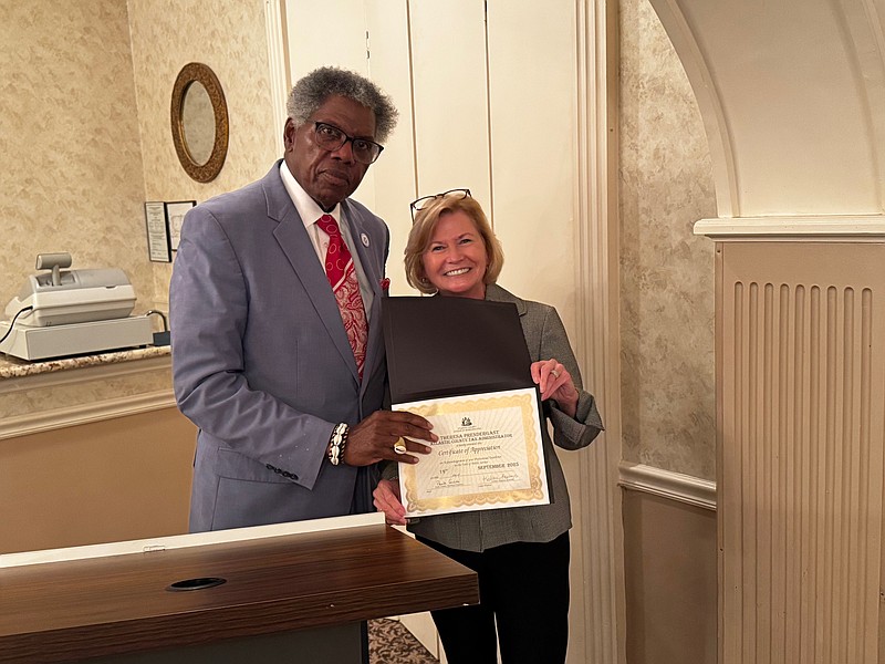 Atlantic County League of Municipalities President Kaleem Shabazz presents a Certificate of Appreciation to Atlantic County Tax Assessor Theresa Prendergast during the Sept. 19 meeting.