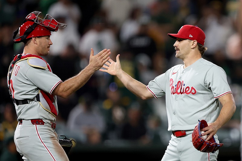 May 23, 2025; West Sacramento, California, USA; Philadelphia Phillies pitcher Tanner Banks (58) celebrates with catcher J.T. Realmuto (10) after defeating the Athletics at Sutter Health Park. Mandatory Credit: Dennis Lee-Imagn Images