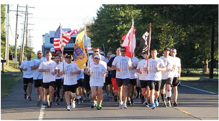 Runners will stop after each mile at a Hero Marker to present a flag and personalized biographical card to waiting family members and friends. (Photos courtesy of New Jersey Run for the Fallen)