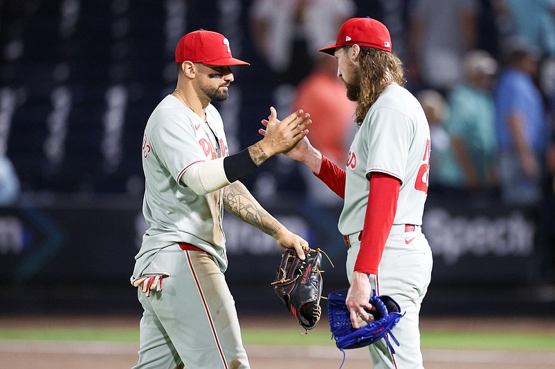 May 6, 2025; Tampa, Florida, USA; Philadelphia Phillies pitcher Matt Strahm (25) and Philadelphia Phillies right fielder Nick Castellanos (8) react after beating the Tampa Bay Rays at George M. Steinbrenner Field. Mandatory Credit: Nathan Ray Seebeck-Imagn Images