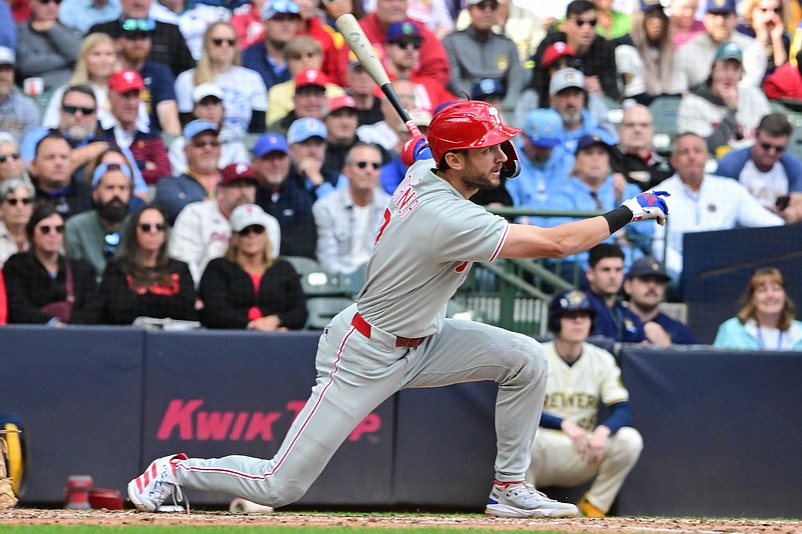Sep 4, 2025; Milwaukee, Wisconsin, USA;  Philadelphia Phillies shortstop Trea Turner (7) drives in a run with a base hit against the Milwaukee Brewers in the seventh inning at American Family Field. Mandatory Credit: Benny Sieu-Imagn Images