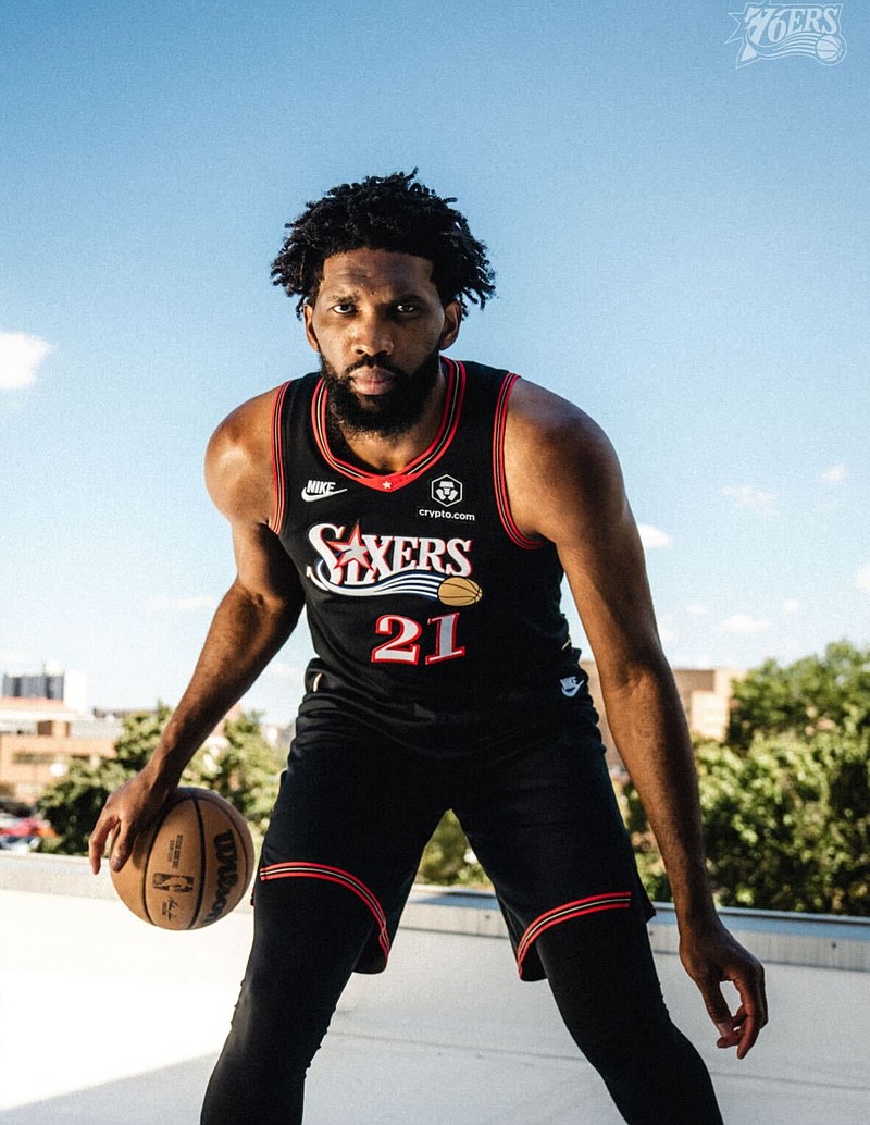 Joel Embiid models the throwback uniforms the Sixers will wear in 2025-26. (Sixers)