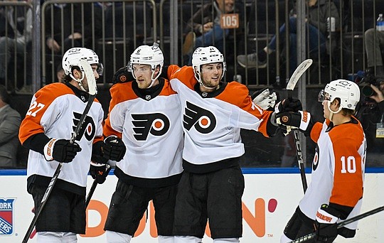Apr 9, 2025; New York, New York, USA;  Philadelphia Flyers right wing Tyson Foerster (71) celebrates his goal against the New York Rangers with right wing Bobby Brink (10), left wing Noah Cates (27) and defenseman Travis Sanheim (6) during the third period at Madison Square Garden. Mandatory Credit: Dennis Schneidler-Imagn Images