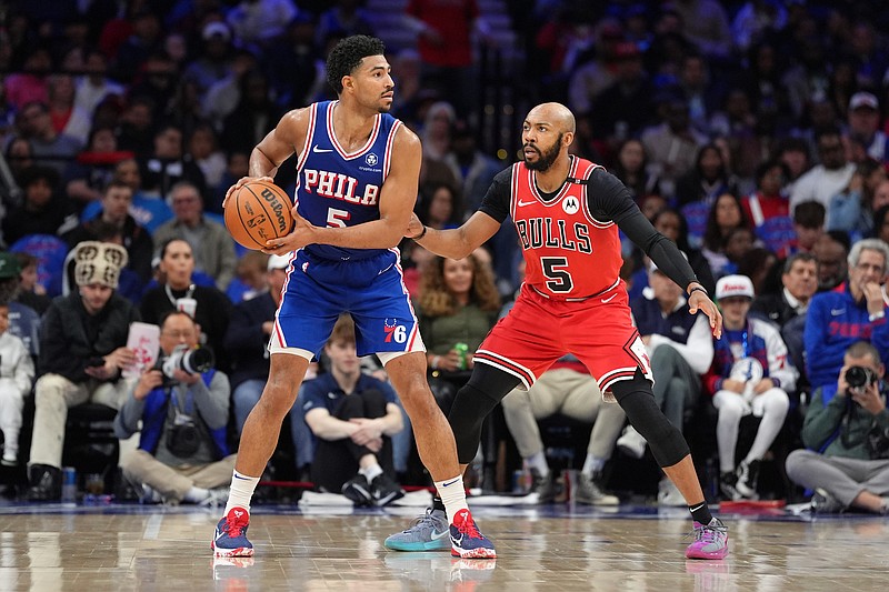 Apr 13, 2025; Philadelphia, Pennsylvania, USA; Philadelphia 76ers guard Quentin Grimes (5) controls the ball against Chicago Bulls guard Jevon Carter (5) in the fourth quarter at Wells Fargo Center. Mandatory Credit: Kyle Ross-Imagn Images