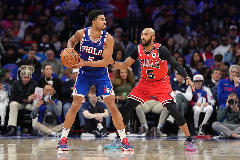 Apr 13, 2025; Philadelphia, Pennsylvania, USA; Philadelphia 76ers guard Quentin Grimes (5) controls the ball against Chicago Bulls guard Jevon Carter (5) in the fourth quarter at Wells Fargo Center. Mandatory Credit: Kyle Ross-Imagn Images