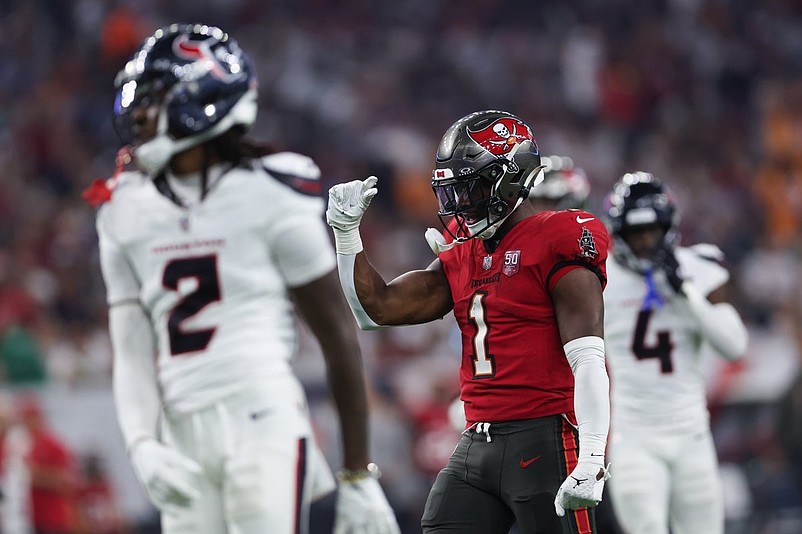 Sep 15, 2025; Houston, Texas, USA; Tampa Bay Buccaneers running back Rachaad White (1) celebrates after a play during the third quarter against the Houston Texans at NRG Stadium. Mandatory Credit: Troy Taormina-Imagn Images