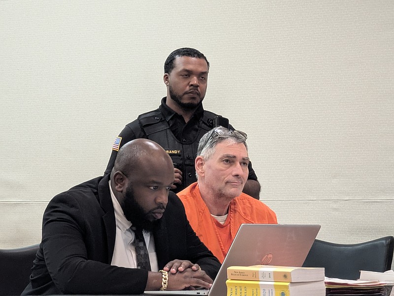 Steven Smink at his sentencing with attorney Durann Neil.