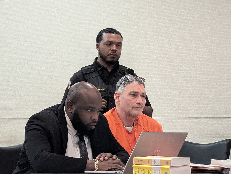 Steven Smink at his sentencing with attorney Durann Neil.